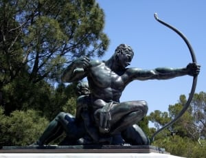 gray archer kneeling concrete statue thumbnail