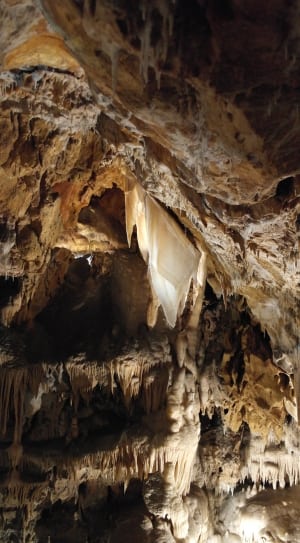 brown and white stalactites and stalagmites thumbnail