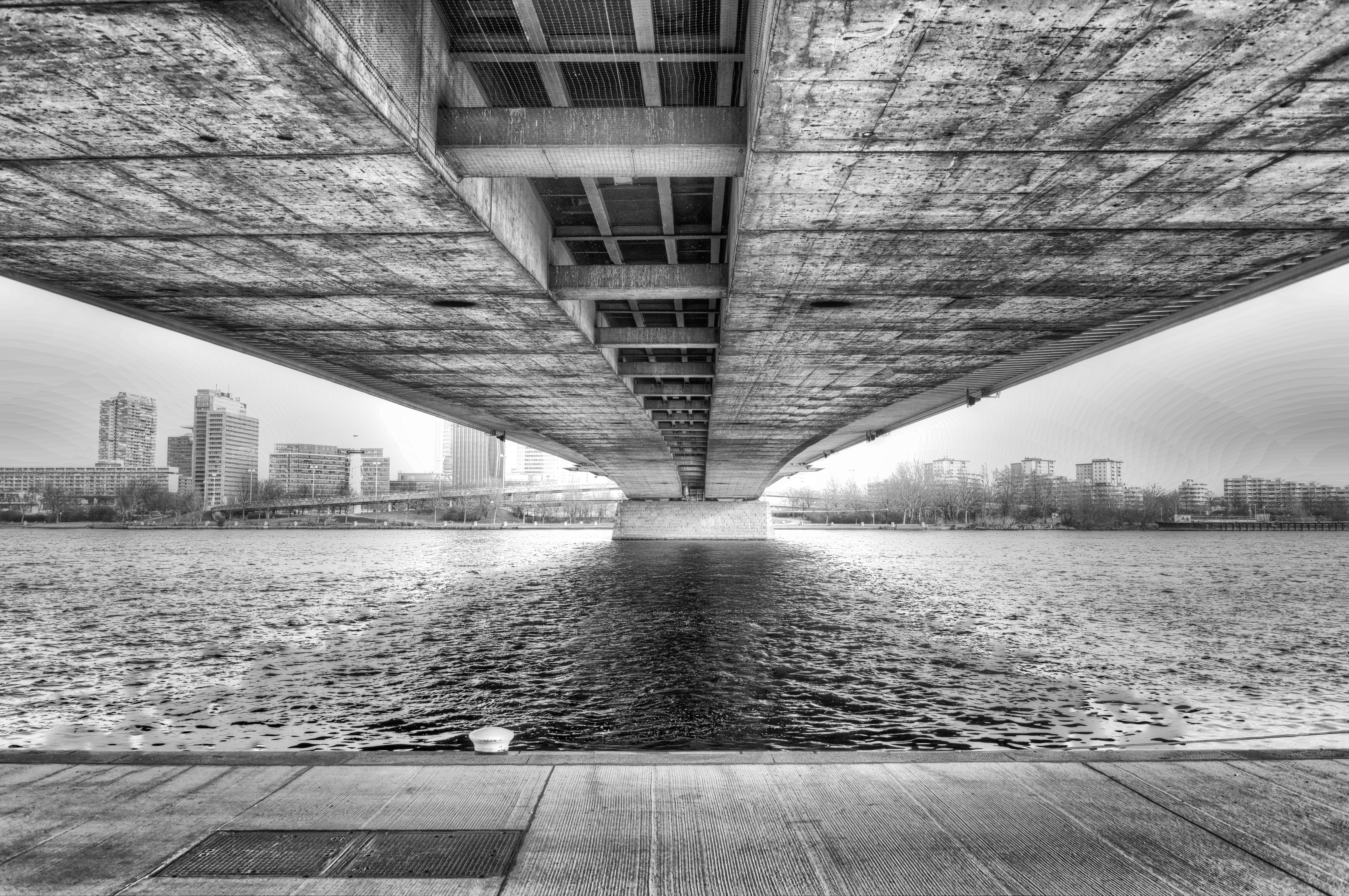 grayscale arhitectural view of concrete bridge