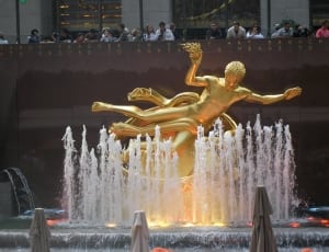 people looking at human outdoor fountain during daytime thumbnail