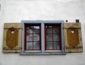 gray brown and red wooden window with shutter decor thumbnail