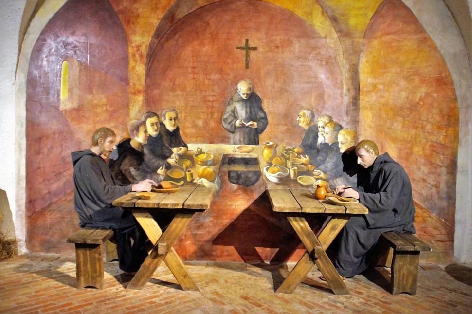 priest on wooden tables preview