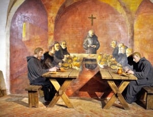 priest on wooden tables thumbnail