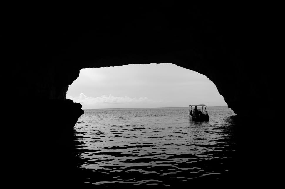 boat under the cave over the water preview