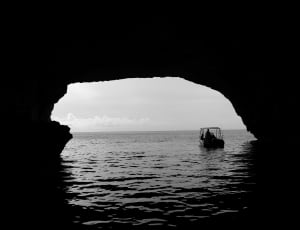 boat under the cave over the water thumbnail