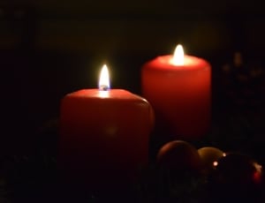 pillar candle lighted during daytime thumbnail