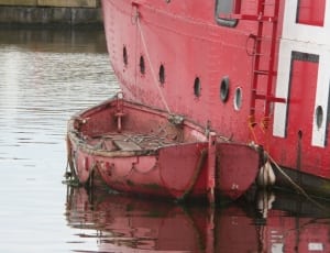 red steel row boat thumbnail
