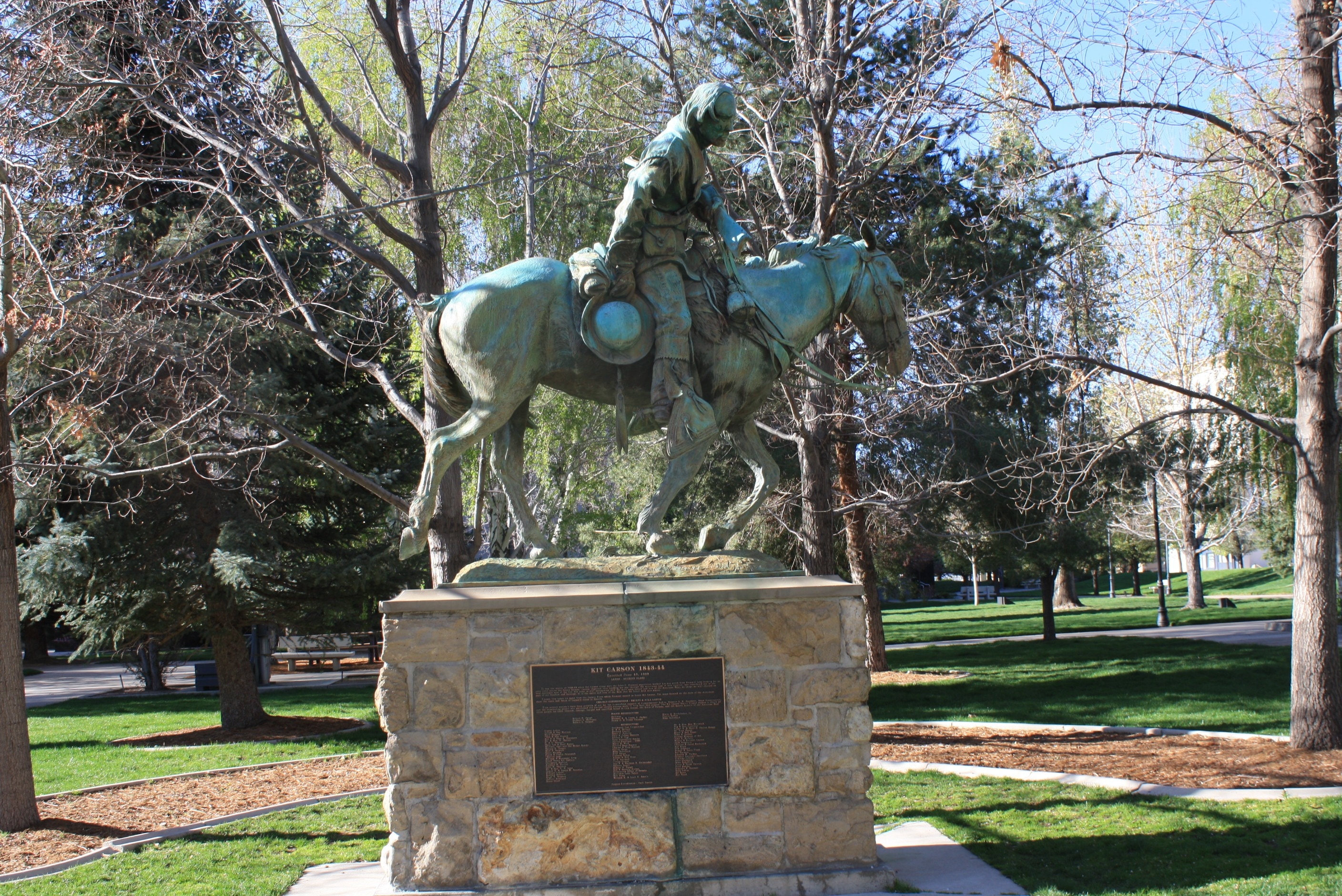 Person riding Horse concrete statuette