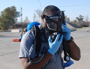 men's gray crew neck t-shirt and black gas mask thumbnail