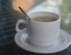 white ceramic coffee mug and saucer thumbnail
