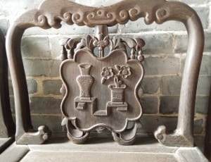 brown wooden frame with flower and vase sculpture design thumbnail