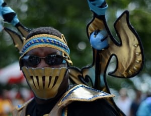 man in gold costume thumbnail