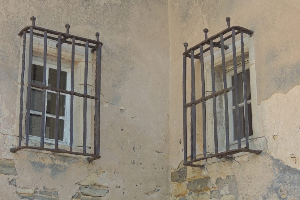 two windows with black metal grills preview