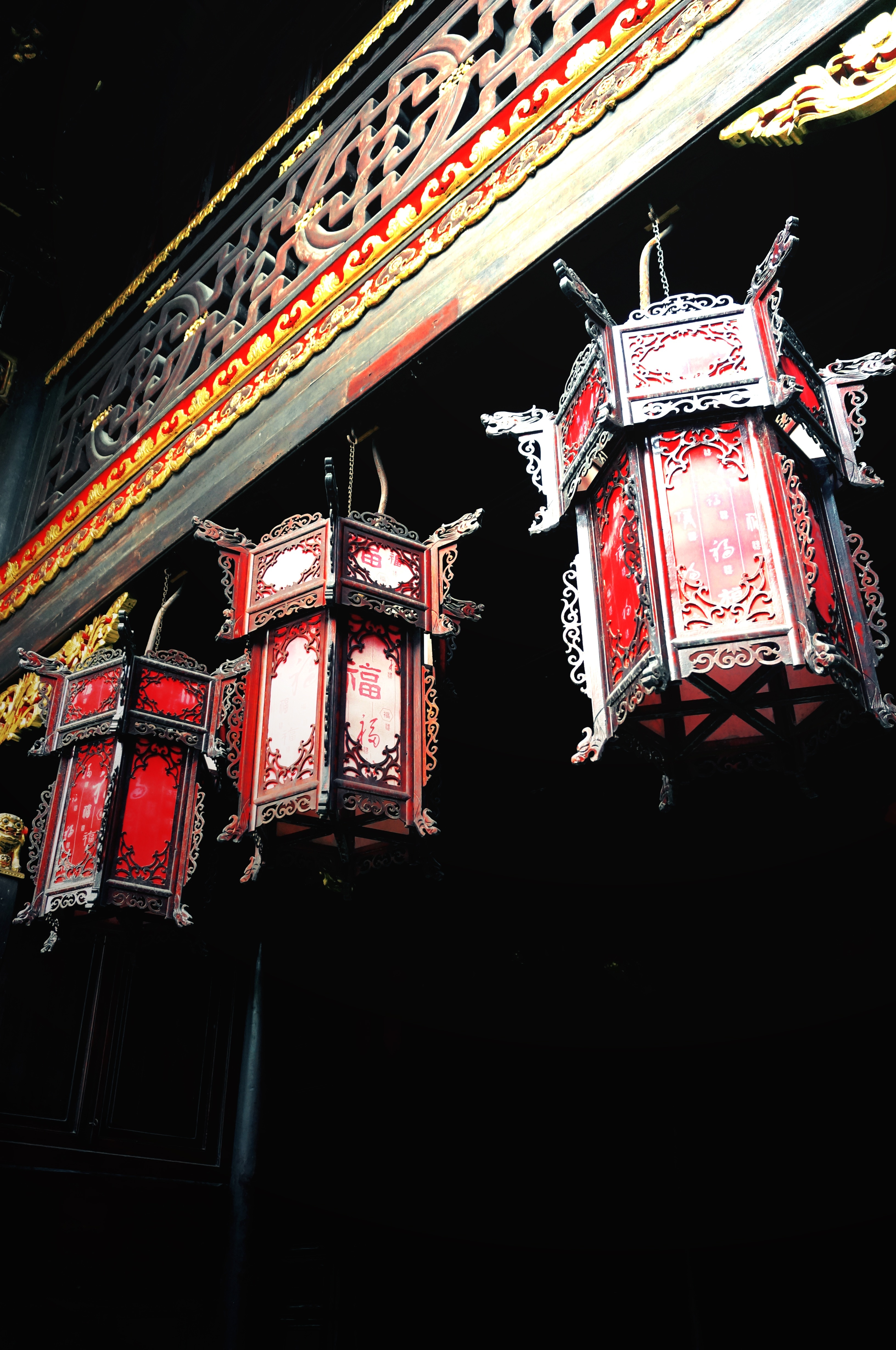 3 black and red lanterns