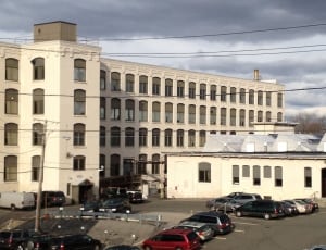 white concrete building near cars during daytime thumbnail