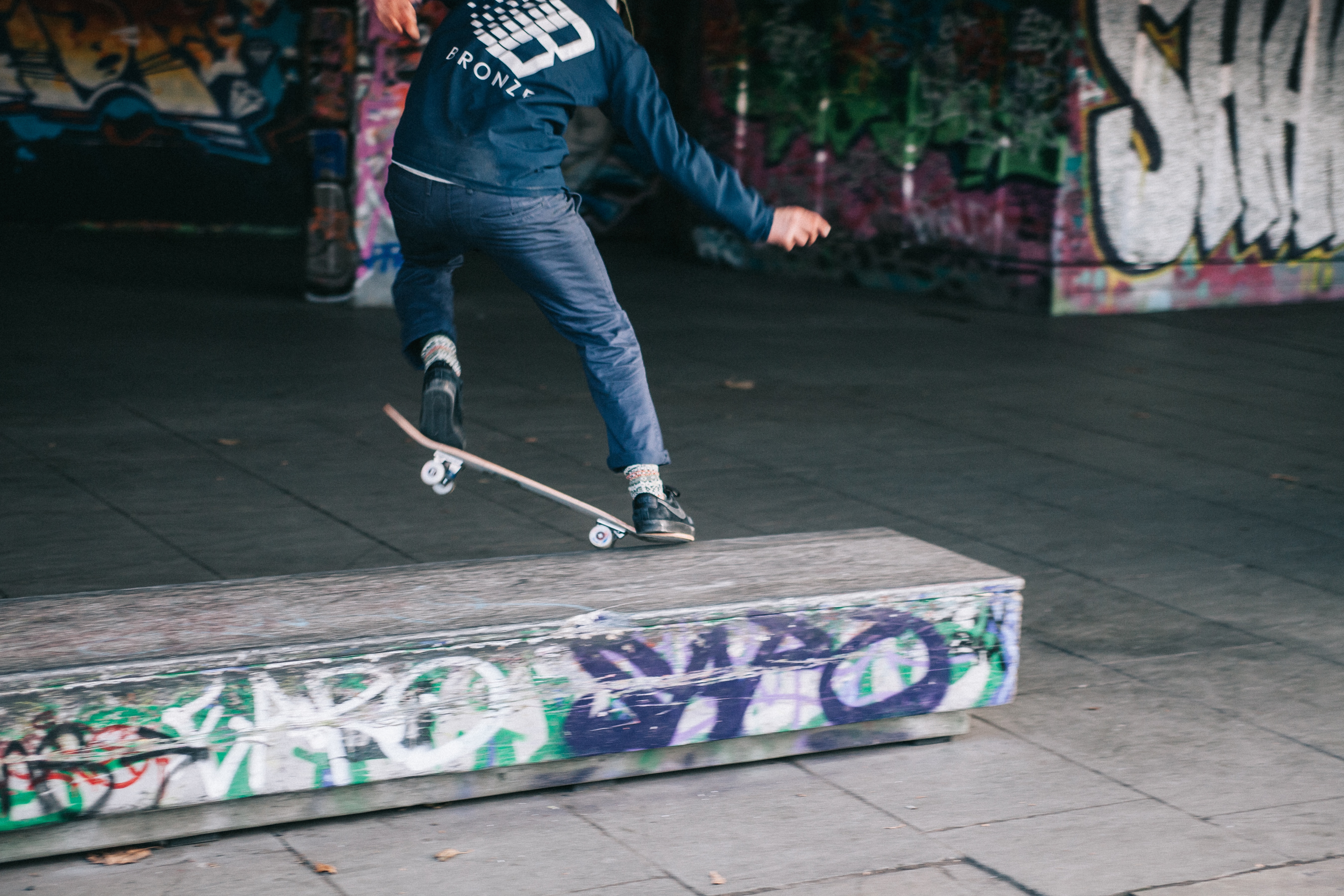 man doing a skateboard grind trick