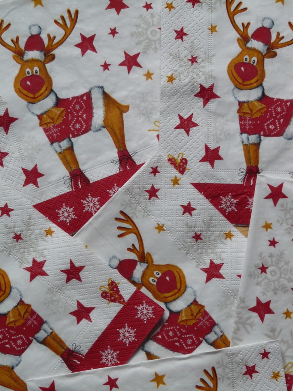 white, red, and brown reindeer print paper preview