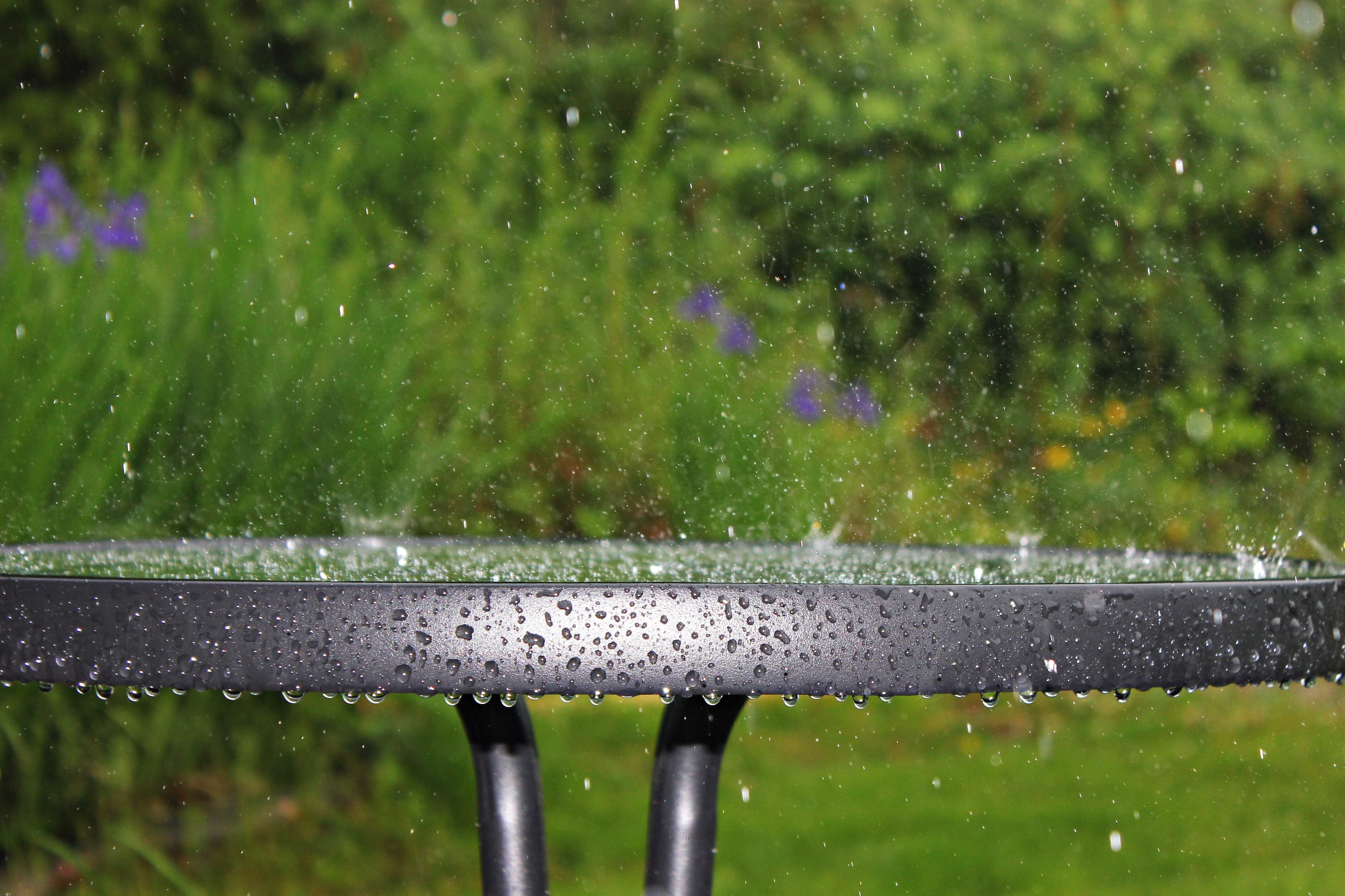 black metal frame round glass top patio table