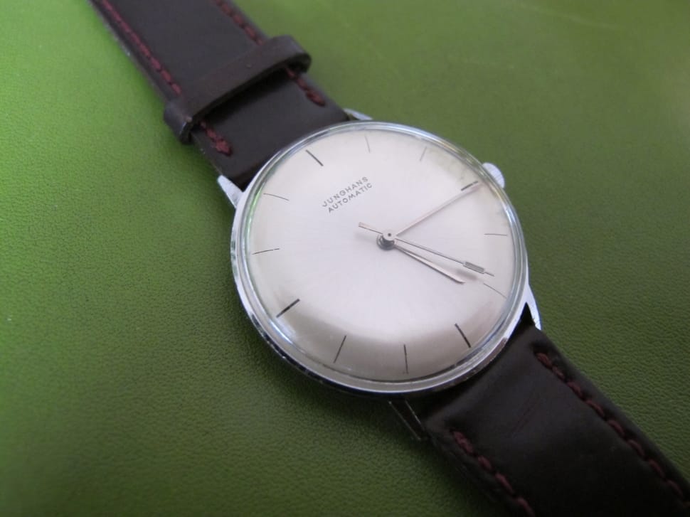 brown leather strap silver round analog watch preview