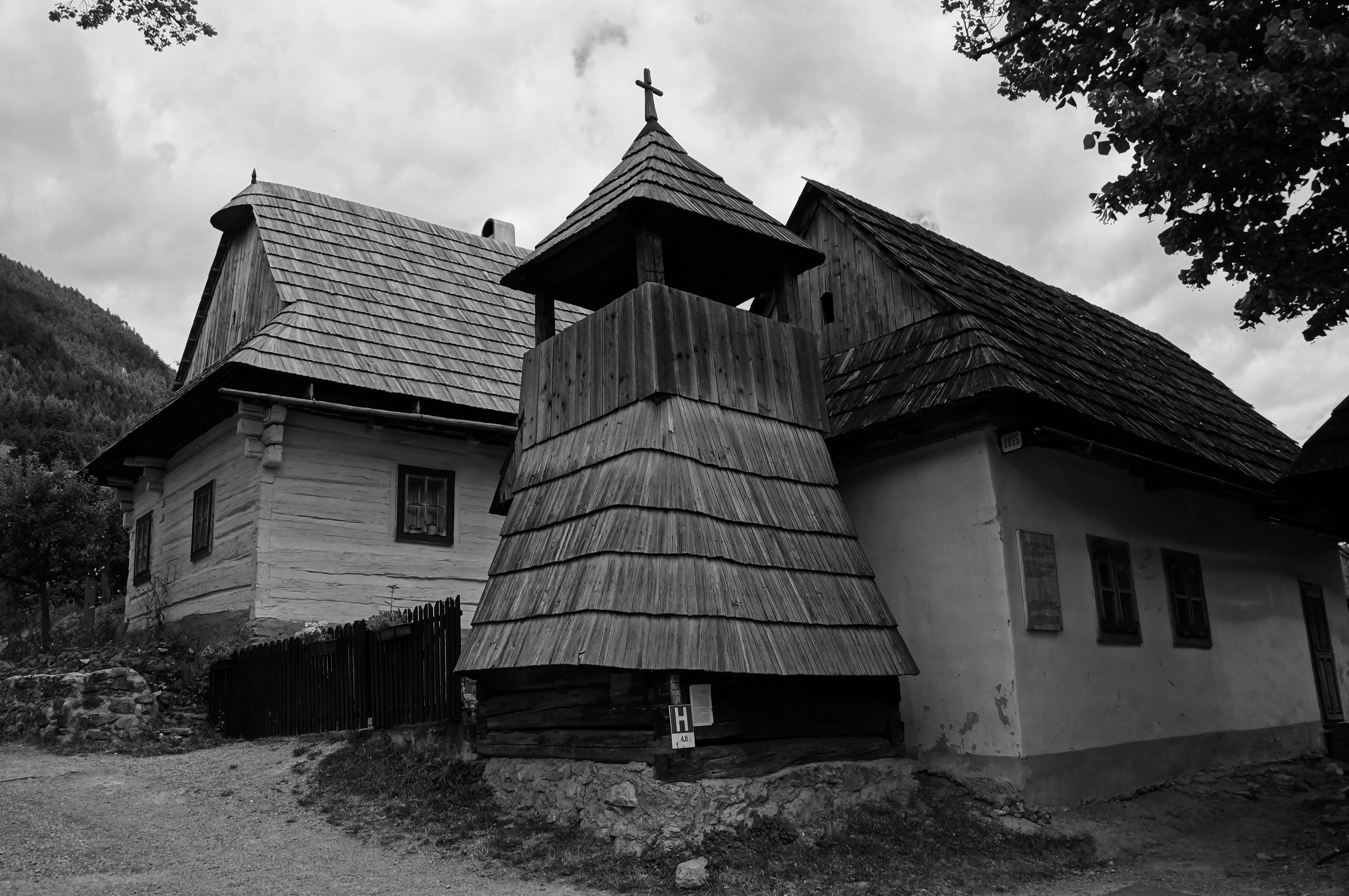 grayscale photography of wooden frame church