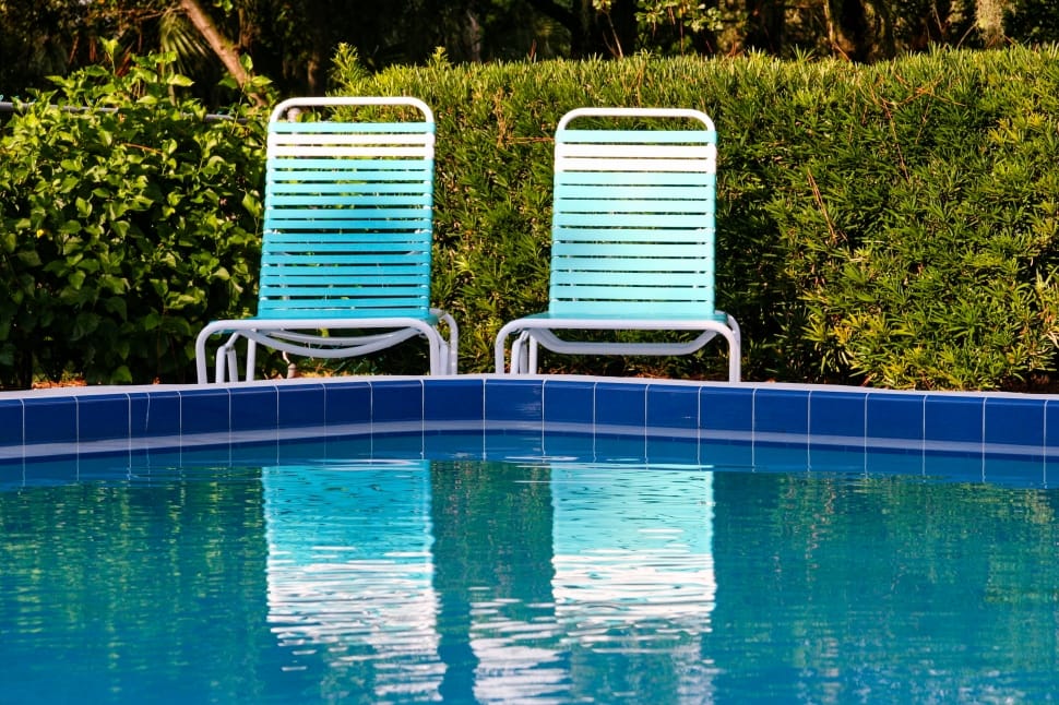 2 blue and white pool side chairs preview