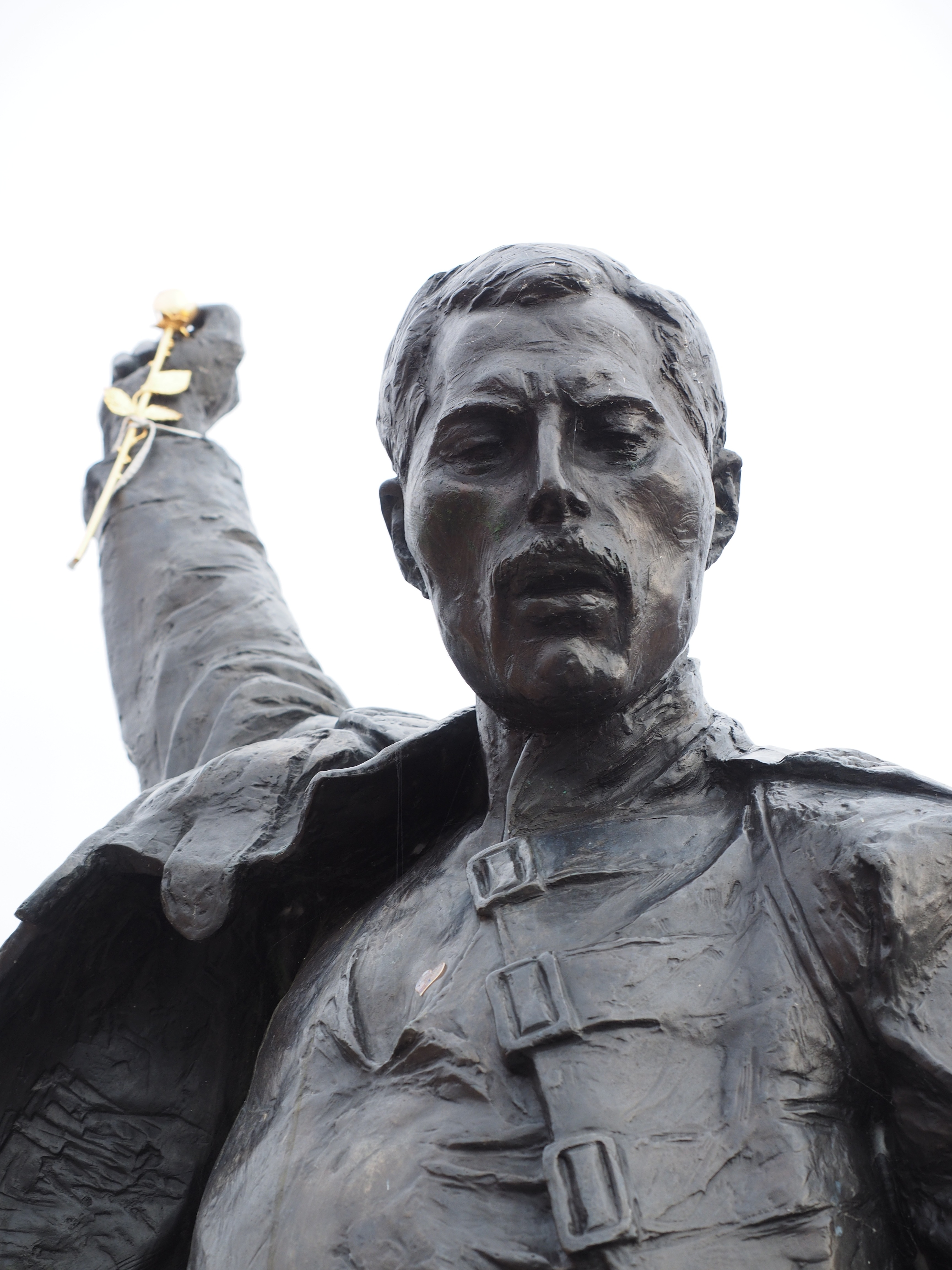 male in uniform stone statue