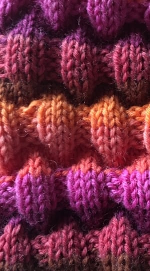 pink purple and yellow rug textile thumbnail