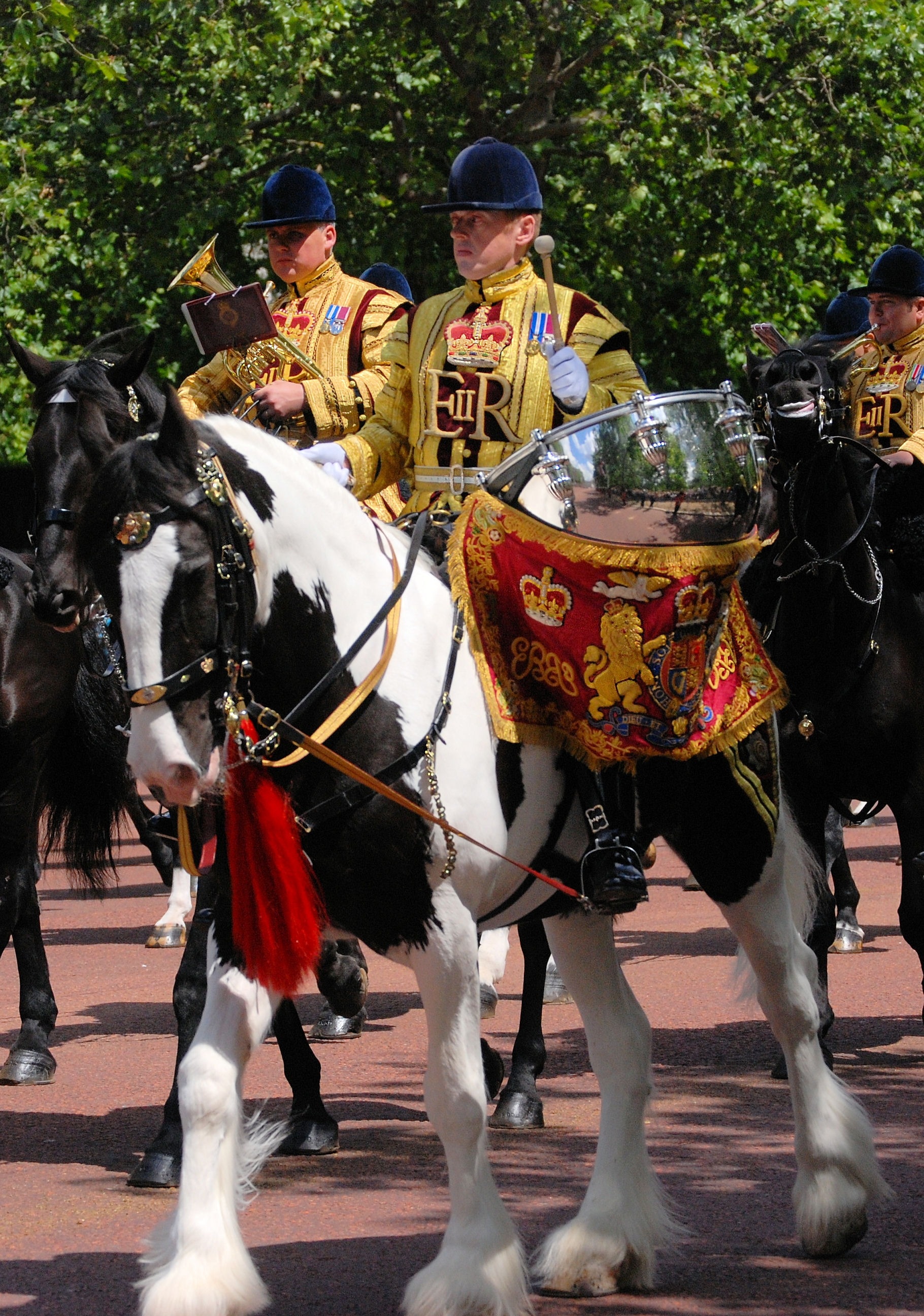 2 royal guards riding on horse