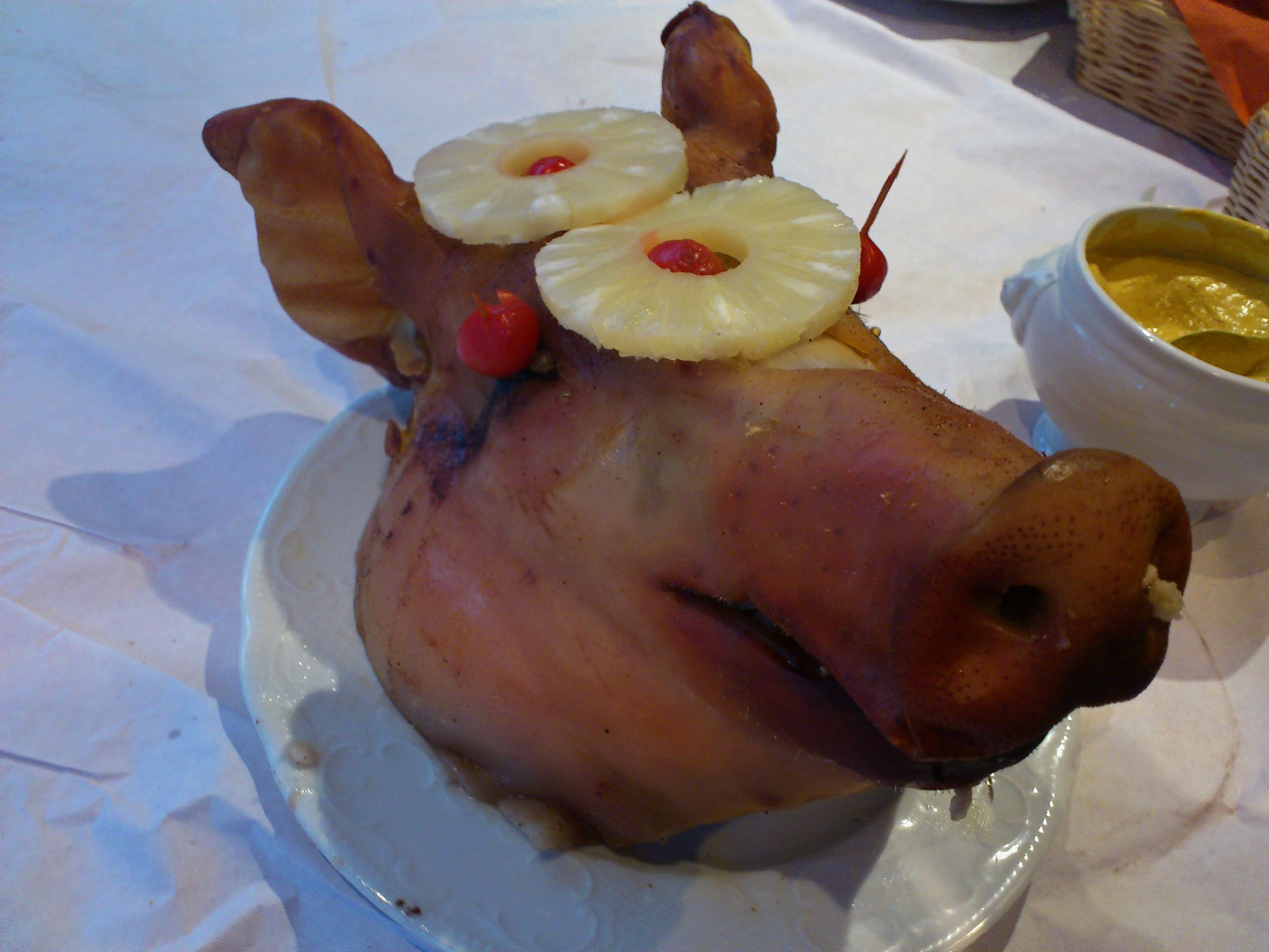 roasted pig head with pineapple slices