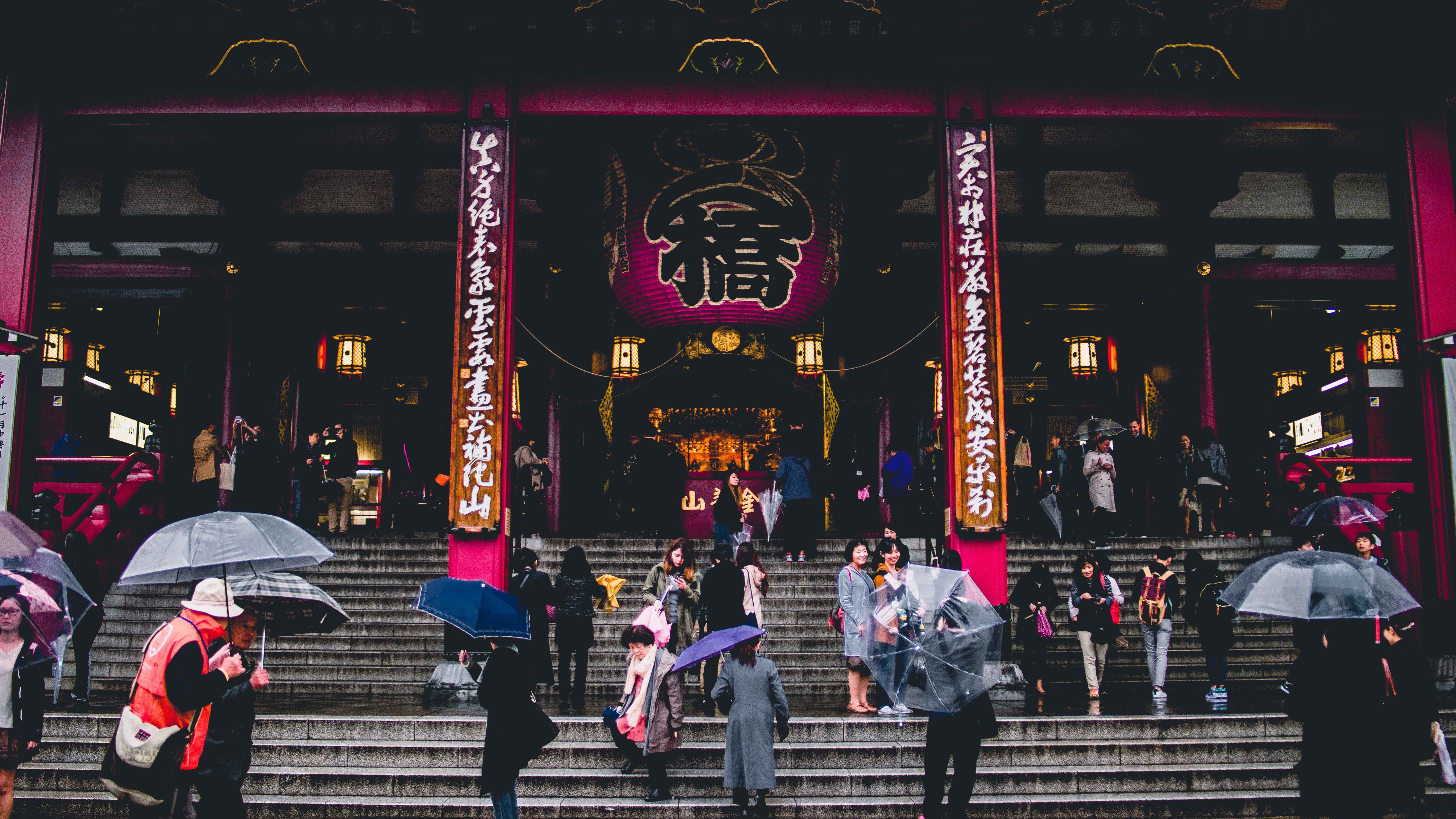 people in front of oriental temple during daytime