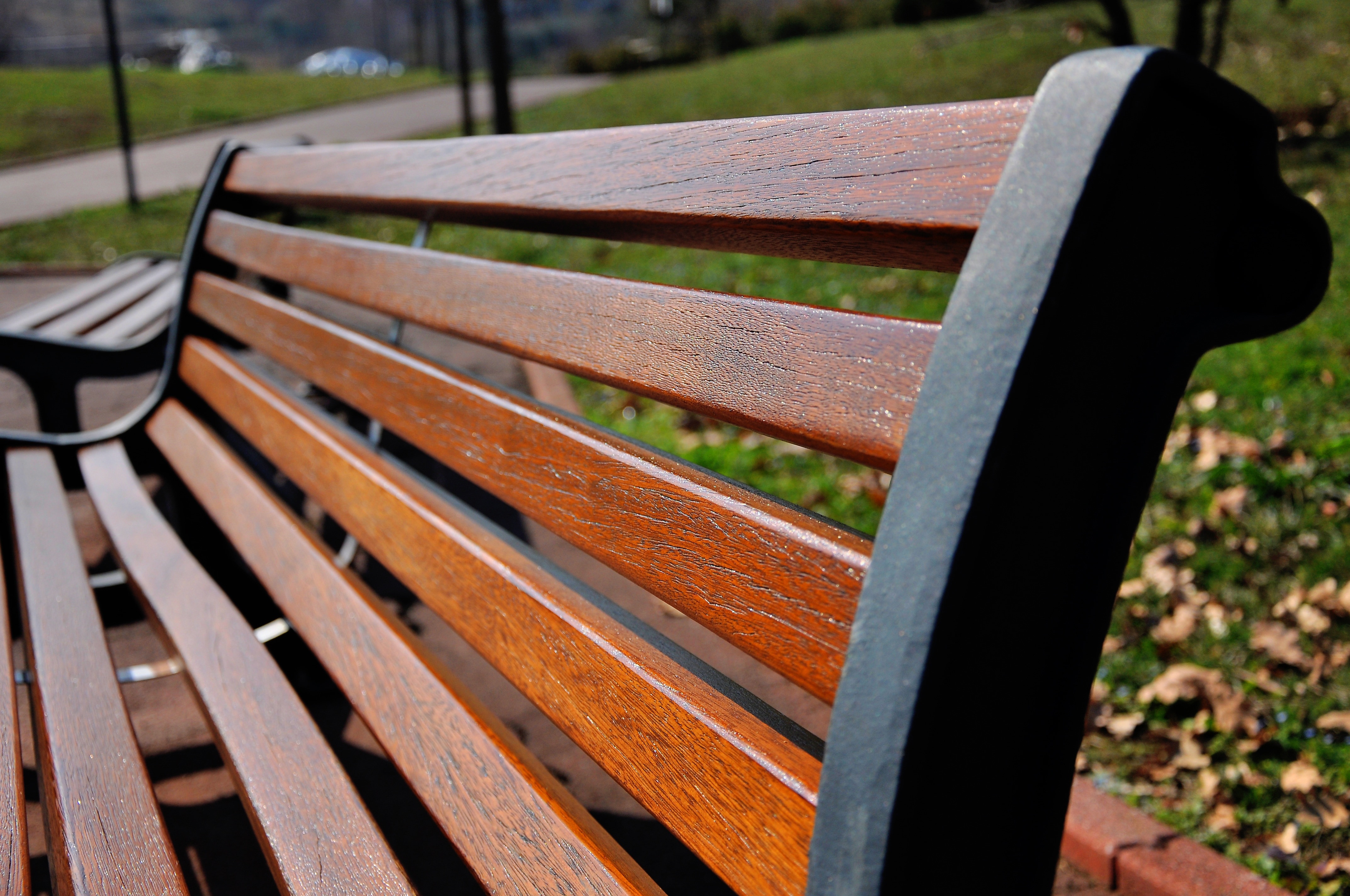 picture of brown and black wooden park bench chair