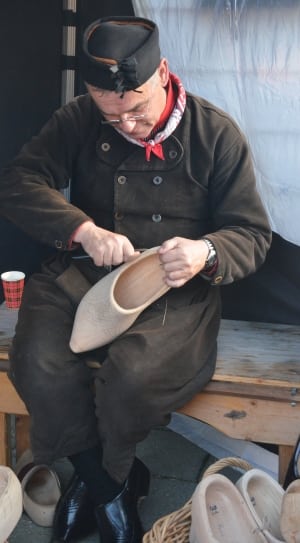 man's beige carved  wooden shoes thumbnail