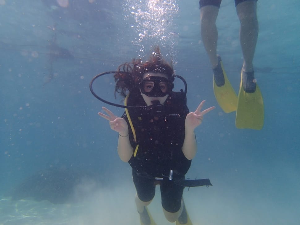 woman wearing black buoyancy compensator underwater preview