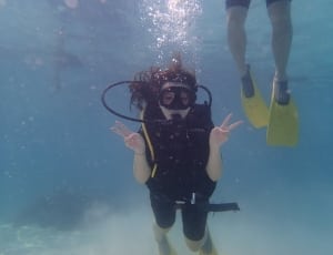 woman wearing black buoyancy compensator underwater thumbnail