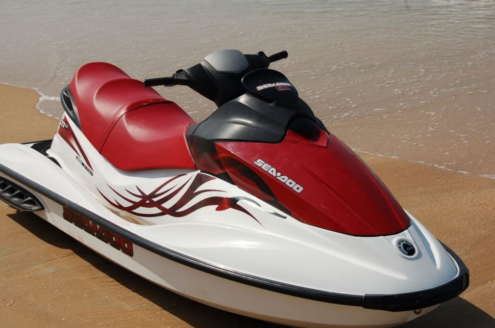 red and white personal water craft preview