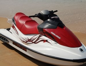 red and white personal water craft thumbnail