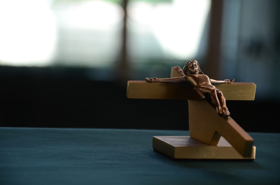 selective focus photo of brown wooden crucifix preview
