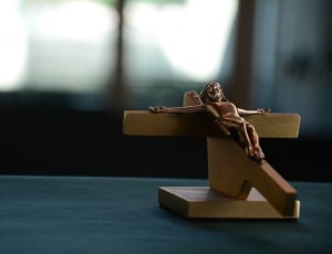 selective focus photo of brown wooden crucifix thumbnail