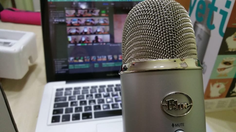 grey blue condenser microphone and macbook pro preview