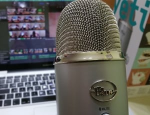 grey blue condenser microphone and macbook pro thumbnail