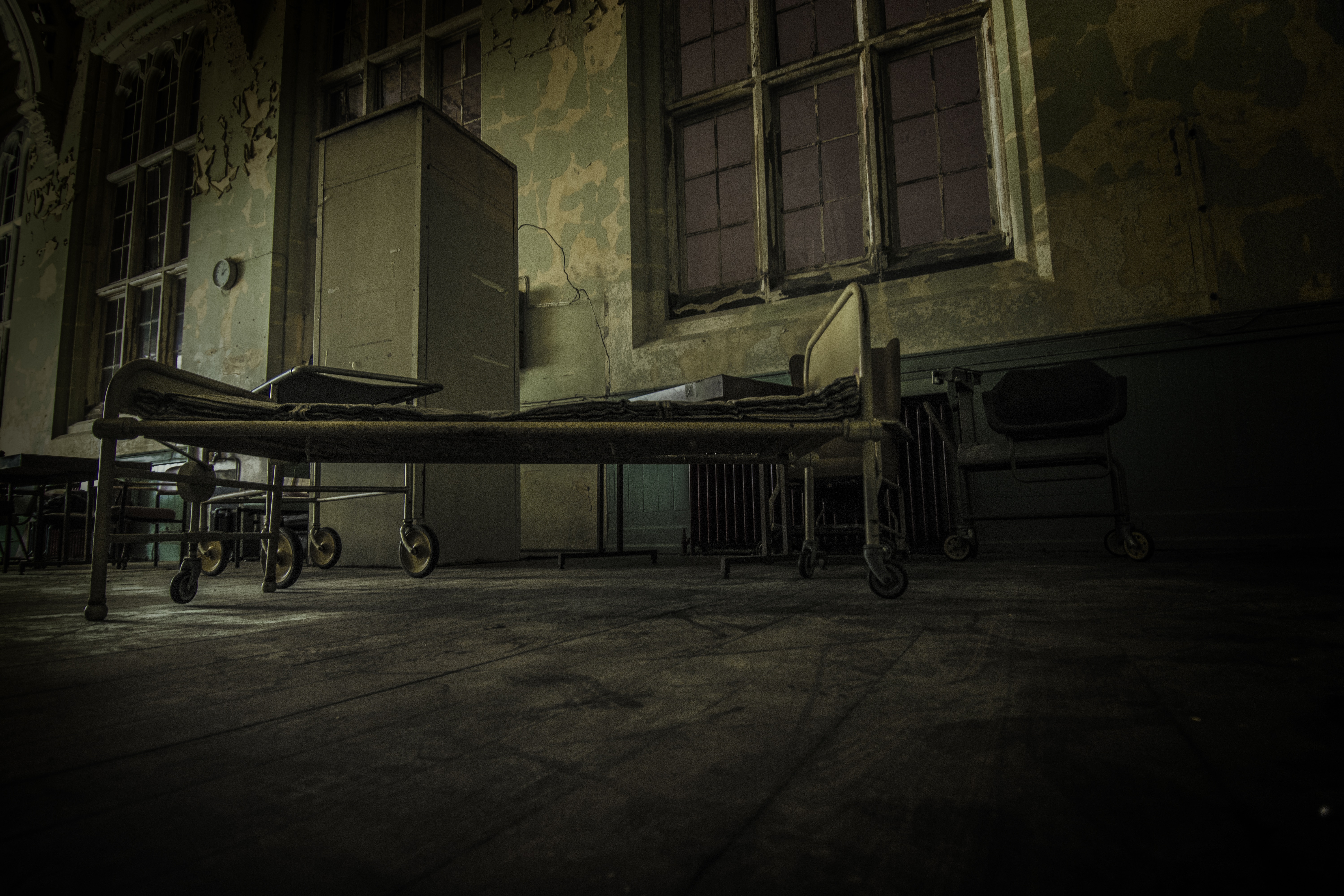 low angle view of grey metal hospital bed