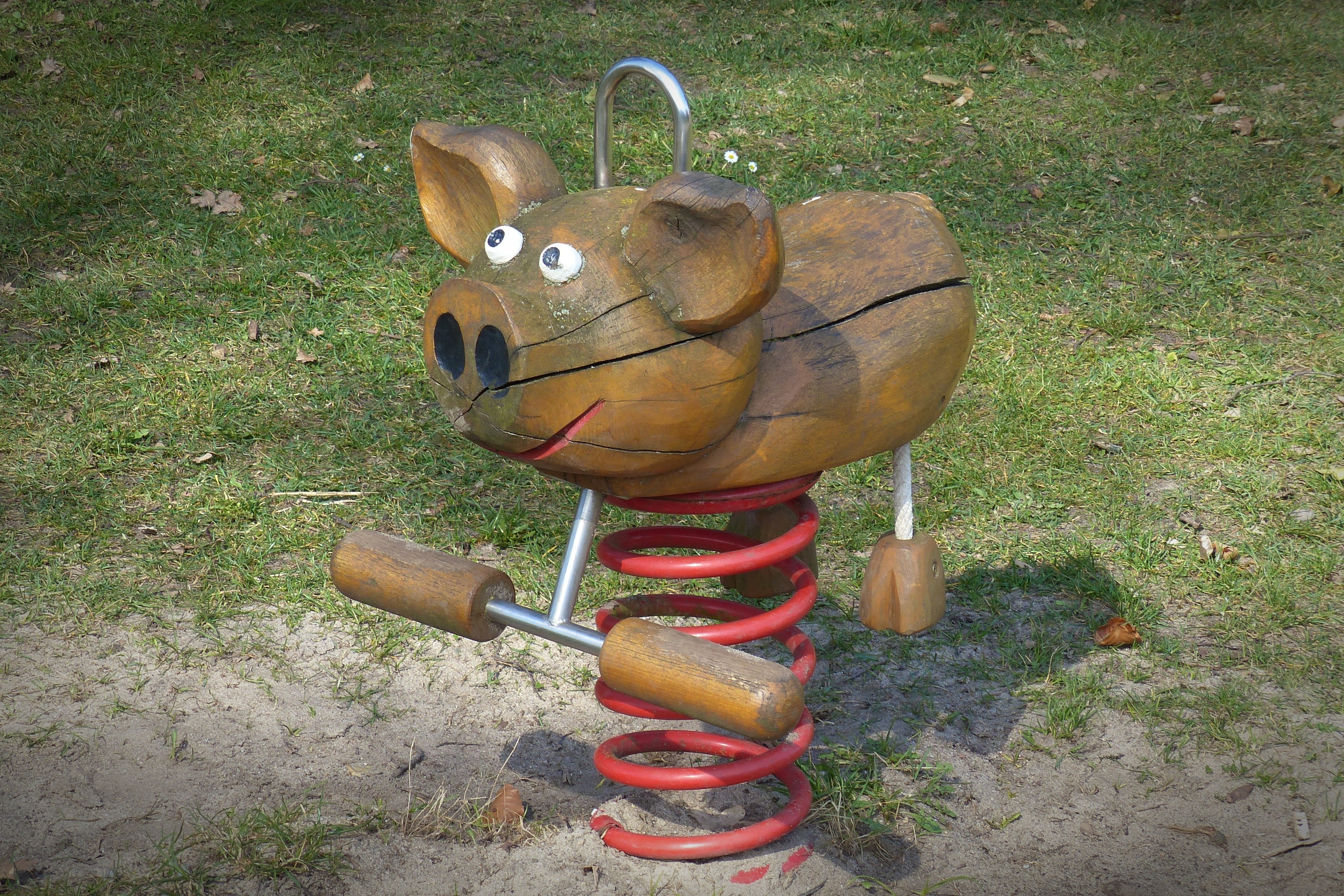 brown wooden spring pig