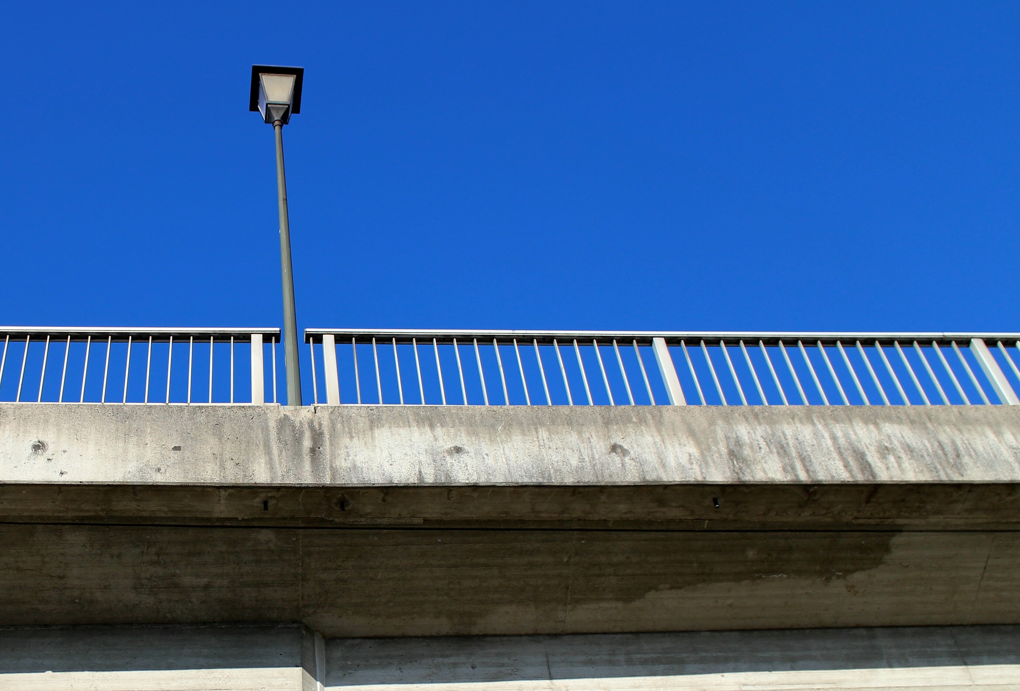 gray concrete bridge with light