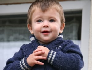 boy's blue and white knitted jacket thumbnail