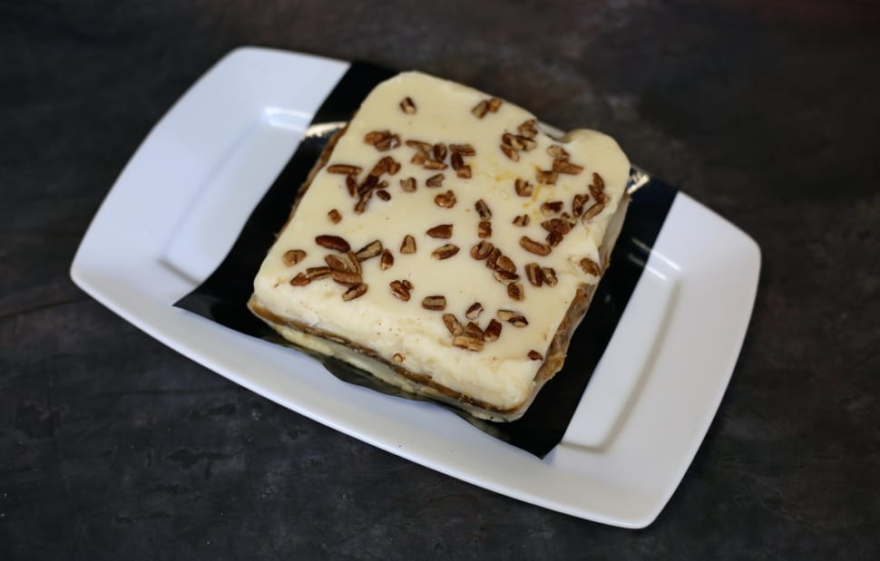 cream topped food on white rectangular ceramic plate preview