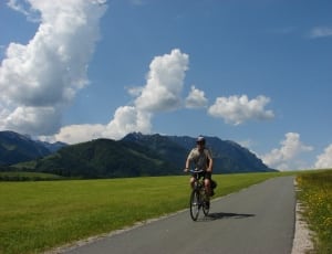 man riding on bike  during daytime thumbnail