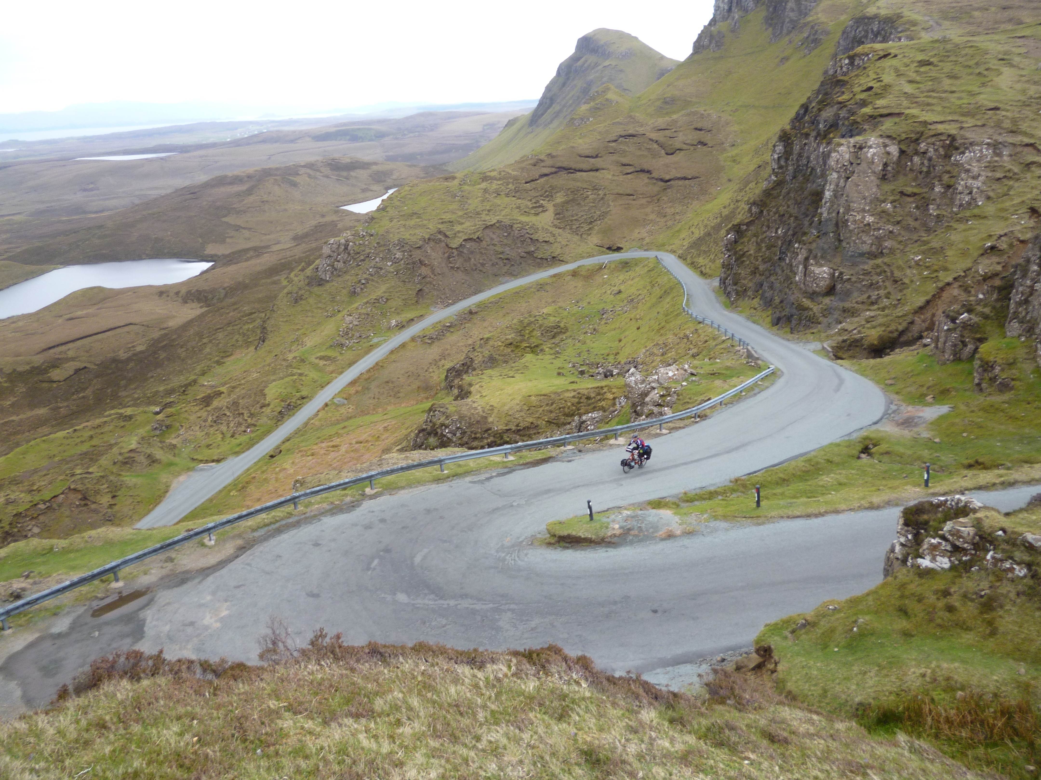 grey concrete road and green mountain