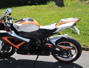 white black and orange sports bike thumbnail