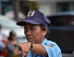 close up photo of person wearing police uniform thumbnail