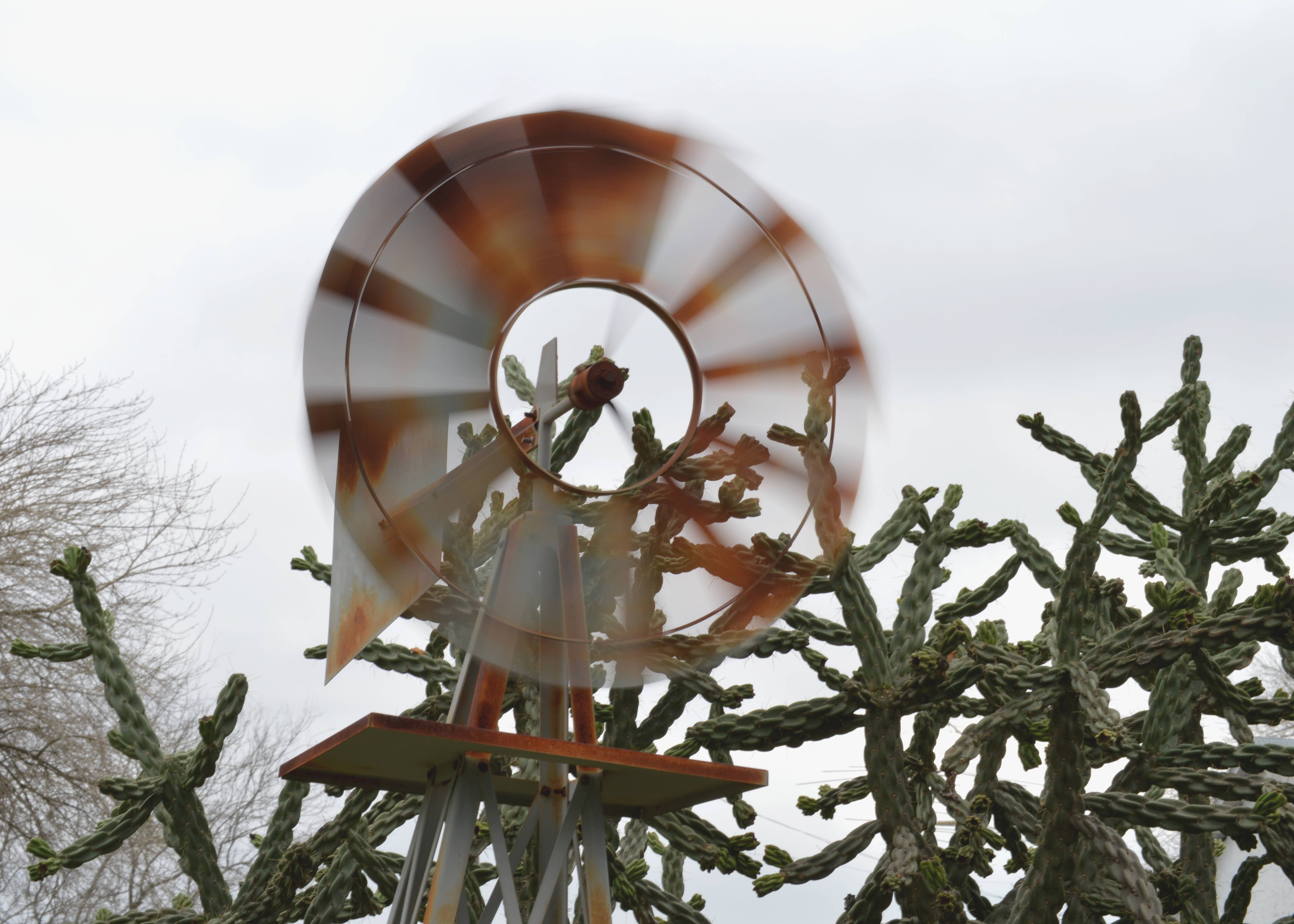 brown and white wind mill spinning